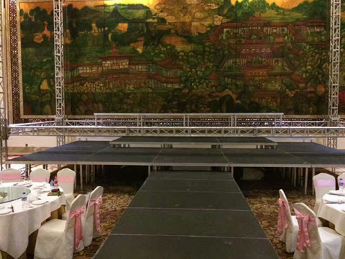 Stage floor material installation methods